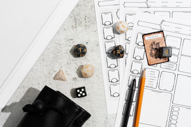 Free Photo still life of objects with role playing game sheet