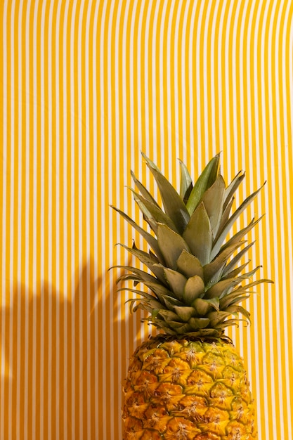 Free photo still life of pineapple fruit with stem and leaves