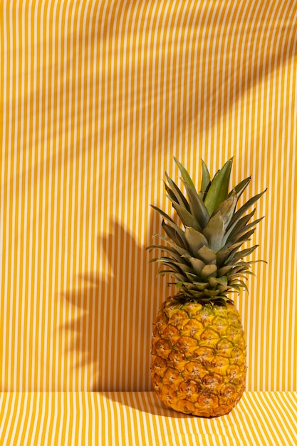 Free photo still life of pineapple fruit with stem and leaves