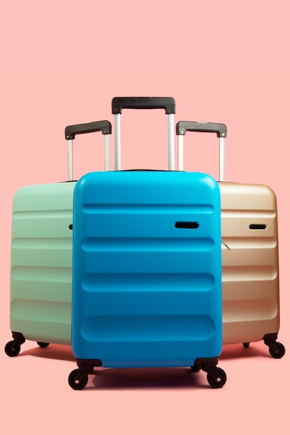 Free photo still life of suitcases with wheels