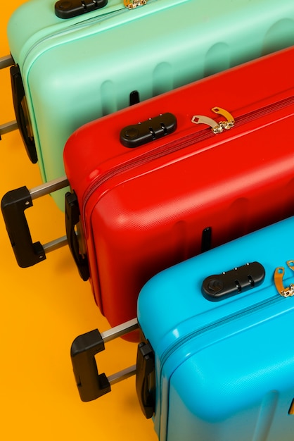 Free Photo still life of suitcases with wheels