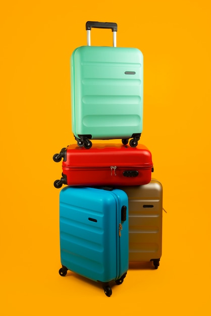 Free Photo still life of suitcases with wheels