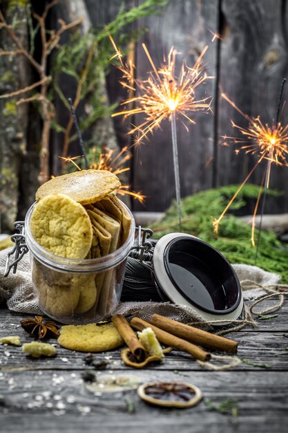 still life with cookies and sparklers on wood