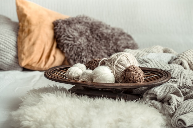 Free photo still life with a cozy variety of yarn for knitting.