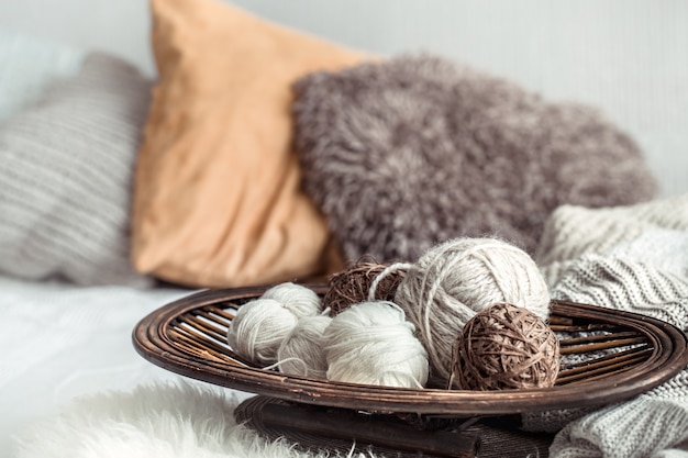 Still life with a cozy variety of yarn for knitting.