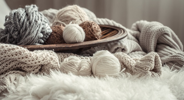 Still life with a cozy variety of yarn for knitting.