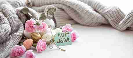 Free photo still life with details of the festive easter decor and the inscription happy easter on the postcard.