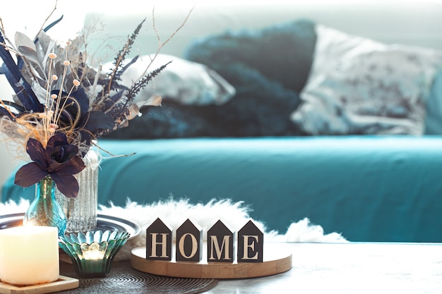 Free photo still life with wooden inscription home, in the living room .