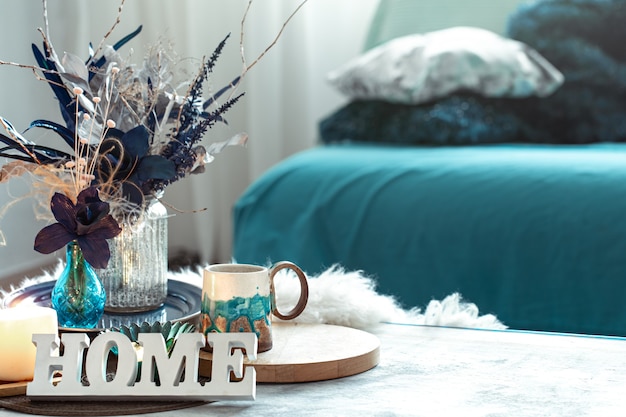 Free photo still life with wooden inscription home, in the living room .