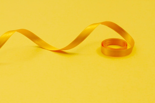 Free photo still life of yellow ribbon