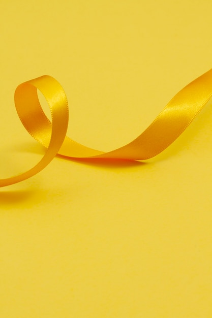 Free Photo still life of yellow ribbon