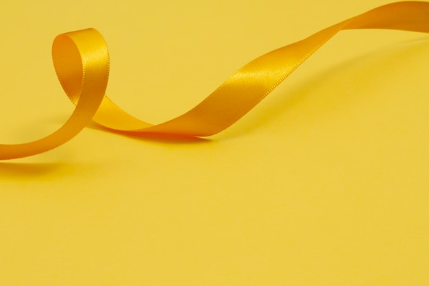 Free photo still life of yellow ribbon