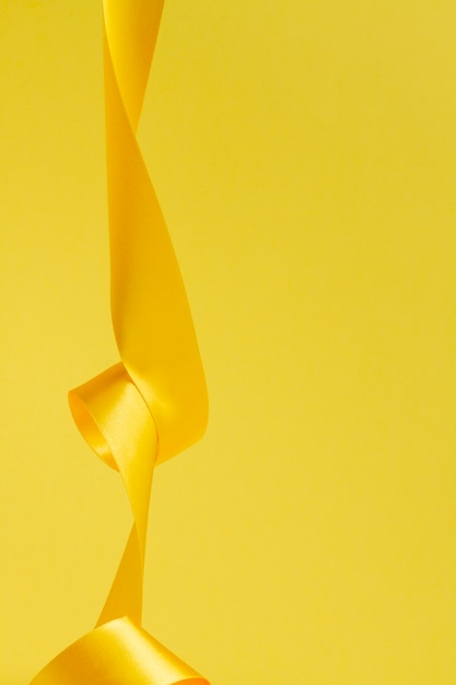 Free photo still life of yellow ribbon