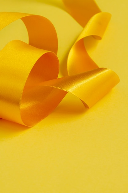 Free photo still life of yellow ribbon