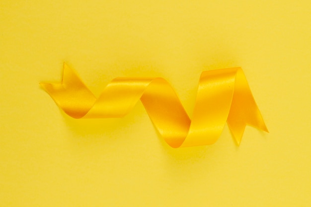 Free Photo still life of yellow ribbon