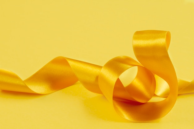 Free Photo still life of yellow ribbon