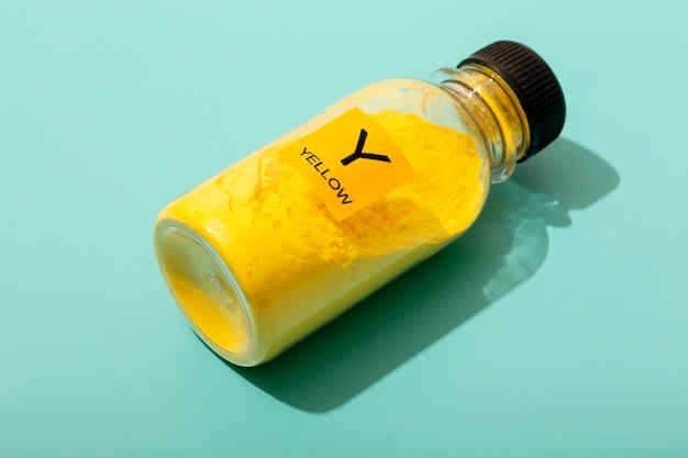 Free photo still life yellow toner arrangement isolated