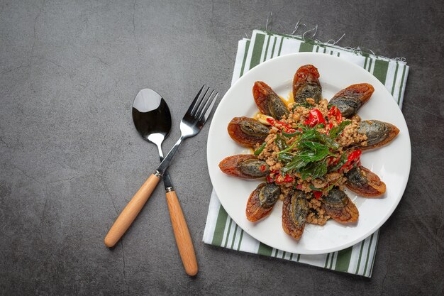 Stir Fried Basil with Spicy Century Egg Served with steamed rice and chili fish sauce, Thai food.