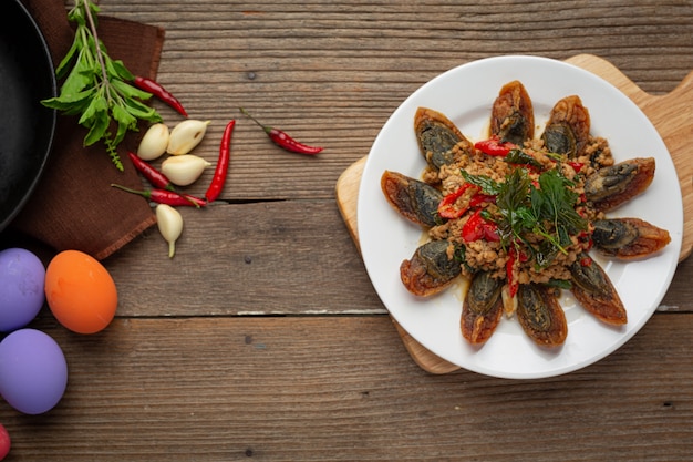 Stir Fried Basil with Spicy Century Egg Served with steamed rice and chili fish sauce, Thai food.