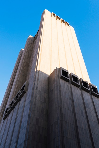 Free photo stone high rise building from below on sunny day