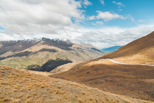 Straight empty highway leading into Aoraki-Mount Cook National Park 