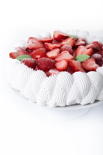 Strawberry cake with cream isolated on white background