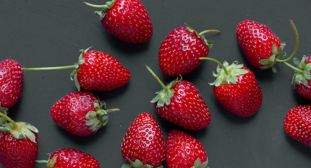 Strawberry demonstration on a grey table. 