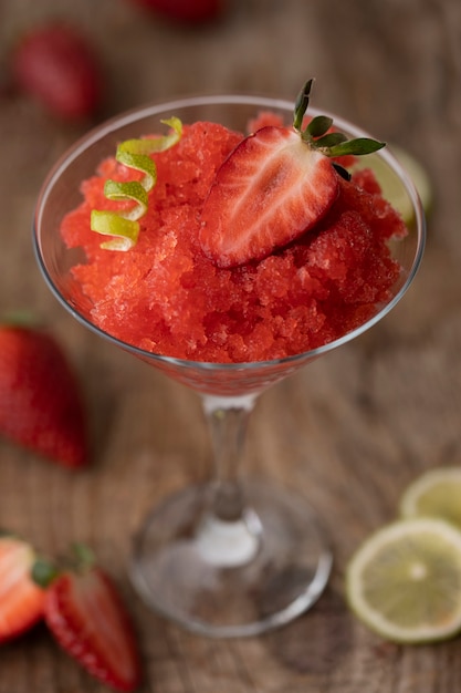 Strawberry granita dessert with lime high angle