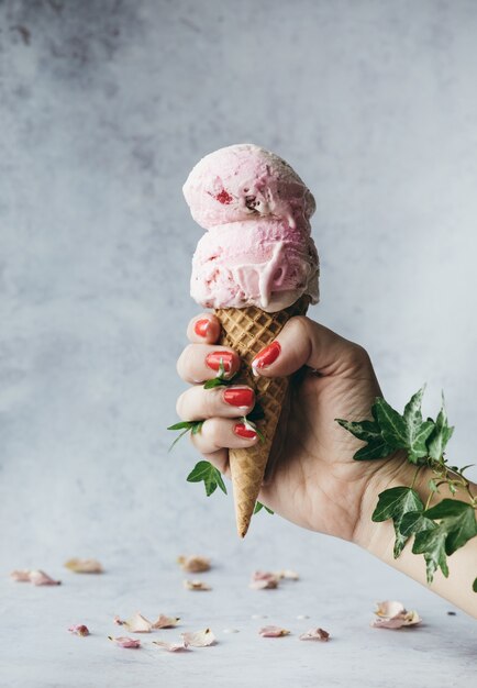 Strawberry ice cream on a cone