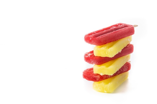 Strawberry and lemon popsicles isolated on white background