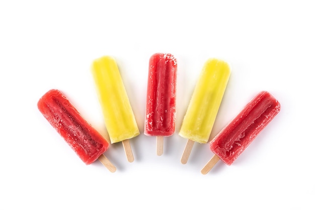 Strawberry and lemon popsicles isolated on white background