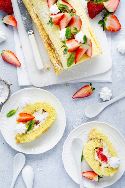 Free photo strawberry swiss roll flat lay food photography