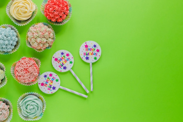 Free photo straws and cupcakes on green