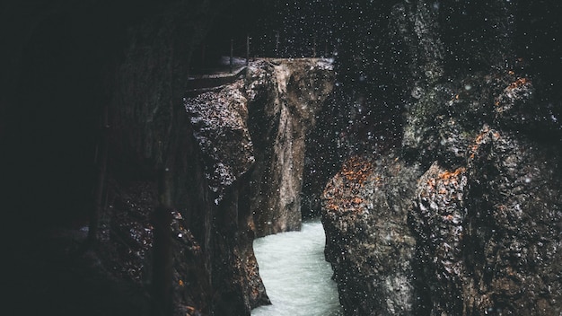 Stream flowing through rocky formations