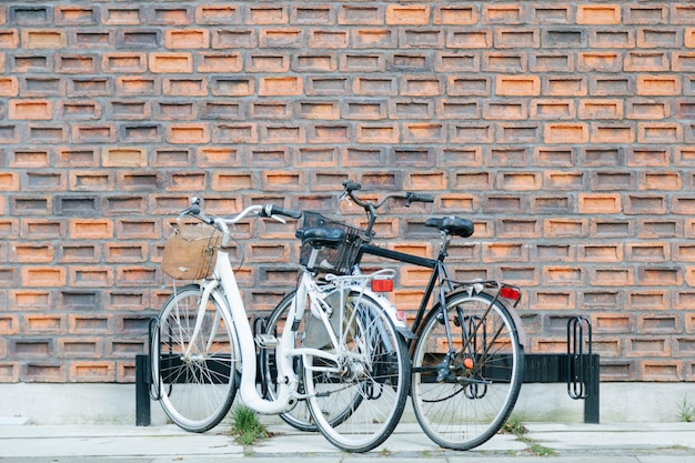 Free photo street parking of bicycles against wall