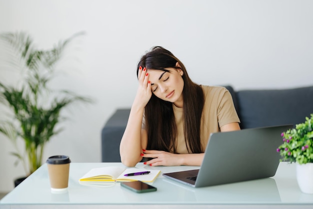 Stressed frustrated young woman student looking at laptop reading bad email internet news feeling sad tired of study work online upset about problem failed exam test results difficult learning