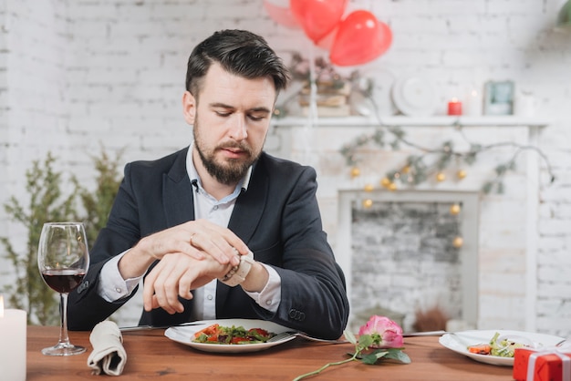 Stressed man waiting for date being late