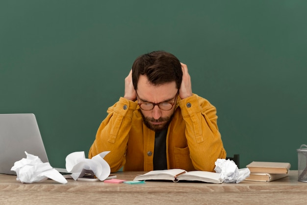 Stressed man working on laptop