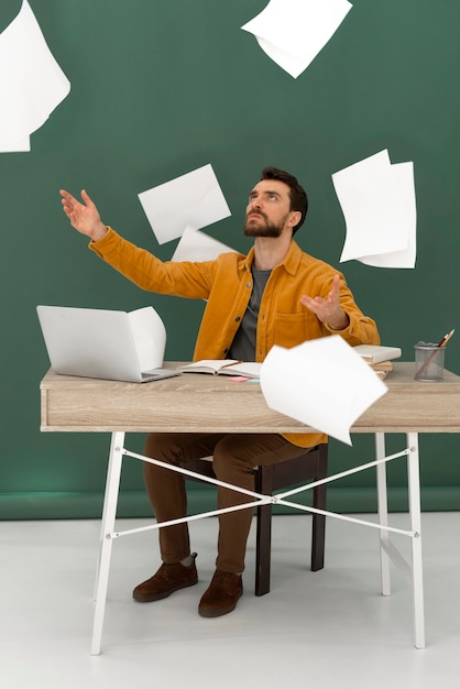 Stressed man working on laptop