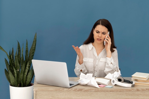 Stressed woman working on laptop