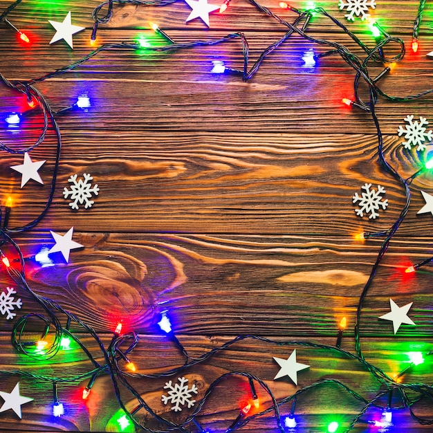 Free photo string lights on wooden surface