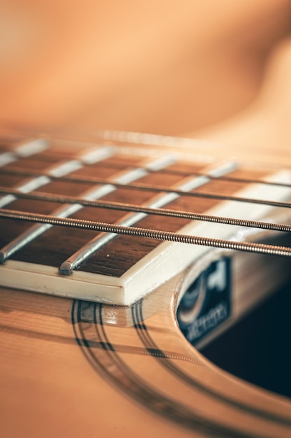 Free photo strings on a classical acoustic guitar macro shot