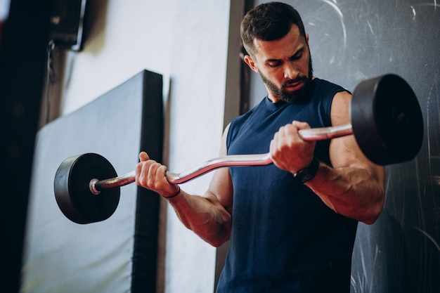 Strong man training in gym