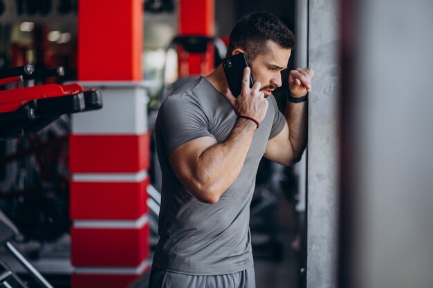 Strong man training in gym