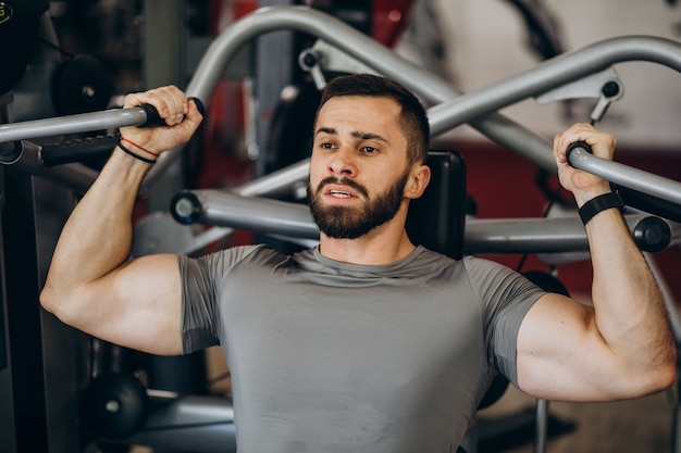 Strong man training in gym