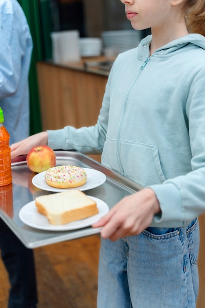 Student having lunch in the canteen