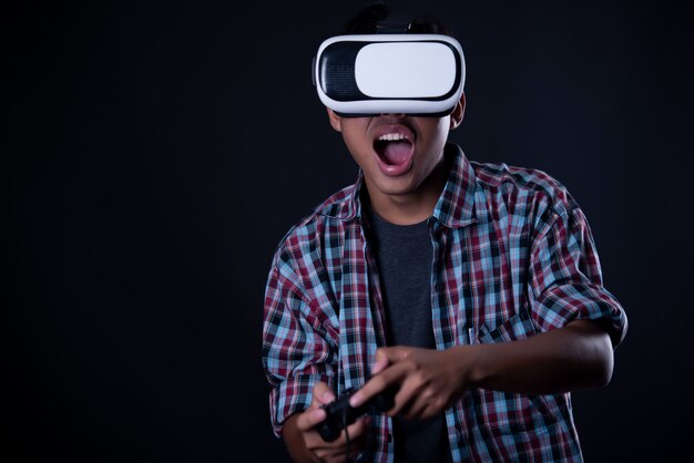 Student man wearing virtual reality goggles, VR headset.