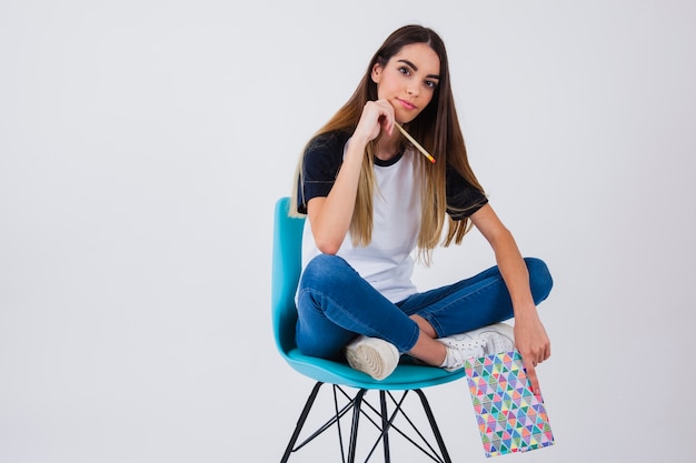 Free Photo student posing on the chair