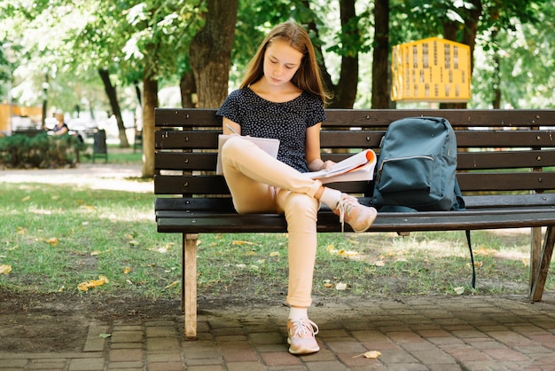 Student preparing for exams in park