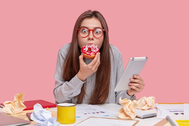 Free photo student sitting at desk with documents